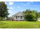 Charming single-story home featuring a landscaped lawn, covered front porch, and classic architectural details at 2519 2Nd Sw Ave, Hickory, NC 28602