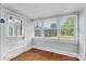 Bright sunroom with hardwood floors, multiple windows and a white door at 2519 2Nd Sw Ave, Hickory, NC 28602