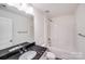 Stylish bathroom with granite countertops, tub-shower and white cabinetry at 2612 Cold Springs Rd, Concord, NC 28025