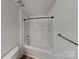 Full bathroom with tub and shower combination, featuring neutral colors, a functional and inviting space at 2612 Cold Springs Rd, Concord, NC 28025