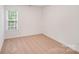 Bright bedroom with a window bringing in natural light and neutral carpeting at 2612 Cold Springs Rd, Concord, NC 28025