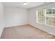 Well-lit bedroom with a large window at 2612 Cold Springs Rd, Concord, NC 28025
