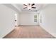 Large bedroom featuring two windows and a ceiling fan at 2612 Cold Springs Rd, Concord, NC 28025