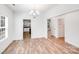 Inviting dining room with chandelier, natural light, and views into the kitchen at 2612 Cold Springs Rd, Concord, NC 28025