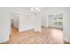 Spacious dining room featuring wood floors, modern lighting, and bright white walls at 2612 Cold Springs Rd, Concord, NC 28025