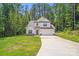 Charming two-story home with attached garage, long drive, and surrounded by mature trees at 2612 Cold Springs Rd, Concord, NC 28025