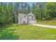 This is a charming two-story home with a well-manicured lawn and driveway at 2612 Cold Springs Rd, Concord, NC 28025