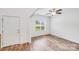 Light-filled foyer with wood floors, white walls, and a view of the front yard at 2612 Cold Springs Rd, Concord, NC 28025