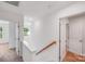 Upstairs hallway with natural light and staircase at 2612 Cold Springs Rd, Concord, NC 28025
