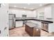 Modern kitchen with stainless steel appliances, granite countertops, and a kitchen island at 2612 Cold Springs Rd, Concord, NC 28025