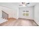 Inviting living room features a staircase and plenty of natural light from a large window at 2612 Cold Springs Rd, Concord, NC 28025