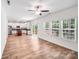 Open-concept living room and kitchen with stainless appliances, island, and access to the outdoor deck at 2612 Cold Springs Rd, Concord, NC 28025