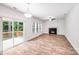 Bright living room features wood floors, fireplace, neutral paint, and glass doors leading to deck at 2612 Cold Springs Rd, Concord, NC 28025