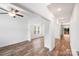 Open-concept living area with wood floors, neutral colors, and sliding glass doors to deck at 2612 Cold Springs Rd, Concord, NC 28025