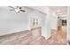 Spacious living area with wood floors, white walls, and natural light throughout the home at 2612 Cold Springs Rd, Concord, NC 28025