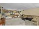 Basement featuring a pool table, a large couch with a coffee table, shelving, and carpeted floors at 2917 Rustic Ln, Charlotte, NC 28210