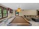 Spacious basement with a pool table, comfortable seating, and natural light from the windows at 2917 Rustic Ln, Charlotte, NC 28210