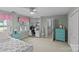 Bright bedroom with a built-in desk and ample closet space at 2917 Rustic Ln, Charlotte, NC 28210