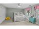 Cozy bedroom with natural light, ceiling fan, and cheerful accents at 2917 Rustic Ln, Charlotte, NC 28210