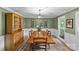 Elegant dining room with hardwood floors, large table, and decorative lighting at 2917 Rustic Ln, Charlotte, NC 28210