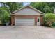 Spacious detached garage with brick exterior and ample parking at 2917 Rustic Ln, Charlotte, NC 28210
