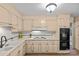 This well-lit kitchen features granite countertops, a stainless steel appliance, and wooden cabinets at 2917 Rustic Ln, Charlotte, NC 28210