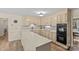 Classic eat-in kitchen featuring tile countertops, stainless steel appliances, and hardwood flooring at 2917 Rustic Ln, Charlotte, NC 28210