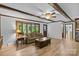 Bright living room with hardwood floors, large windows, and comfortable seating area at 2917 Rustic Ln, Charlotte, NC 28210