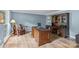 Spacious office with hardwood floors, large desk, and custom built-in shelving at 2917 Rustic Ln, Charlotte, NC 28210