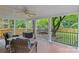 Relaxing covered patio with outdoor seating overlooking the backyard at 2917 Rustic Ln, Charlotte, NC 28210