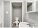 Half-bath features neutral walls, updated vanity, and fixtures at 307 Elm St, Belmont, NC 28012