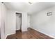 Bedroom featuring hardwood floors and walk-in closet at 307 Elm St, Belmont, NC 28012