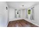 Bedroom features hardwood floors and neutral walls and curtains at 307 Elm St, Belmont, NC 28012
