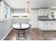 Cozy kitchen featuring modern lighting, white cabinets, and granite countertops at 307 Elm St, Belmont, NC 28012