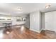 Open-concept living and kitchen area featuring hardwood floors and a bright, airy space at 307 Elm St, Belmont, NC 28012