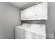 Laundry room featuring a new washer and dryer at 307 Elm St, Belmont, NC 28012