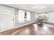Open-concept living space featuring gleaming hardwood floors and ample natural light at 307 Elm St, Belmont, NC 28012