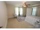 Airy bedroom featuring a four-poster bed, neutral walls, and large windows providing natural light at 309 S Greene St, Wadesboro, NC 28170