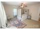 Well-lit bedroom showcases a four-poster bed, neutral walls, and a decorative rug creating a serene space at 309 S Greene St, Wadesboro, NC 28170