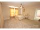 Inviting bedroom with neutral tones, a bed, a ceiling fan, and natural light, creating a calming space at 309 S Greene St, Wadesboro, NC 28170
