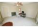 Large bedroom with a ceiling fan, neutral carpet, and natural light from the windows at 309 S Greene St, Wadesboro, NC 28170