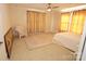 Sunlit bedroom featuring a comfortable bed, a decorative rug, and elegant curtains at 309 S Greene St, Wadesboro, NC 28170