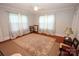 A bright and spacious bedroom with hardwood floors, a ceiling fan, and natural light at 309 S Greene St, Wadesboro, NC 28170