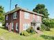 Charming two-story brick home with a covered entryway and lush landscaping at 309 S Greene St, Wadesboro, NC 28170