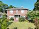 Charming brick home featuring a well-manicured lawn and lovely landscaping at 309 S Greene St, Wadesboro, NC 28170