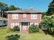 Charming two-story red brick home with white trim, mature landscaping, and a welcoming front porch at 309 S Greene St, Wadesboro, NC 28170