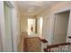 Hallway with multiple doorways and an elegant patterned rug, offering access to various rooms at 309 S Greene St, Wadesboro, NC 28170