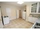 A classic kitchen featuring white appliances, ample counter space and decorative tile flooring at 309 S Greene St, Wadesboro, NC 28170