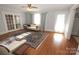 Spacious living room with hardwood floors, area rug, and natural light at 309 S Greene St, Wadesboro, NC 28170
