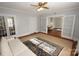 Bright living room featuring hardwood floors, built-in bookshelves, and classic architectural details at 309 S Greene St, Wadesboro, NC 28170